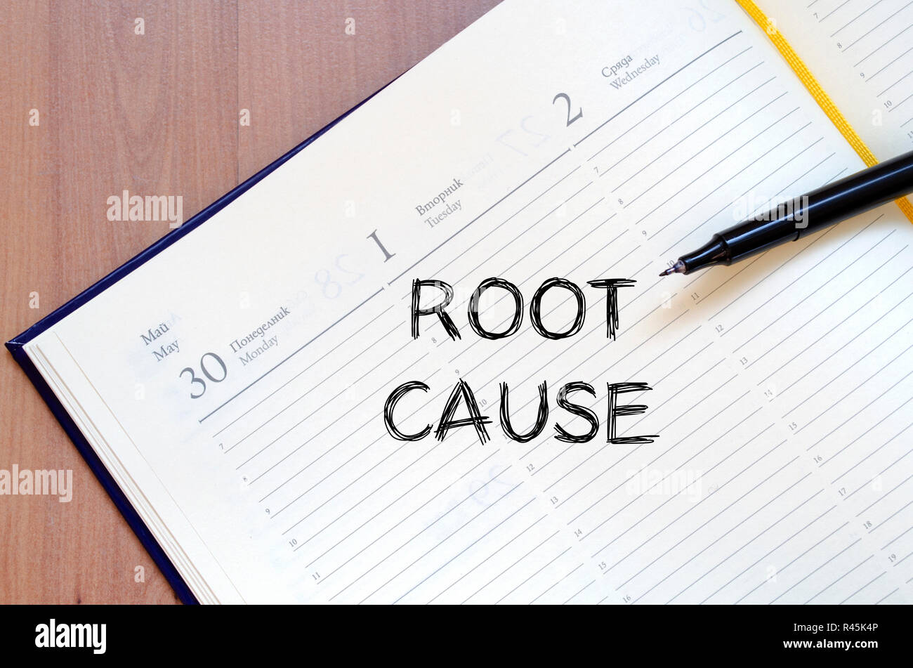 Root cause write on notebook Stock Photo