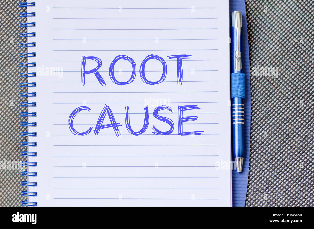 Root cause write on notebook Stock Photo
