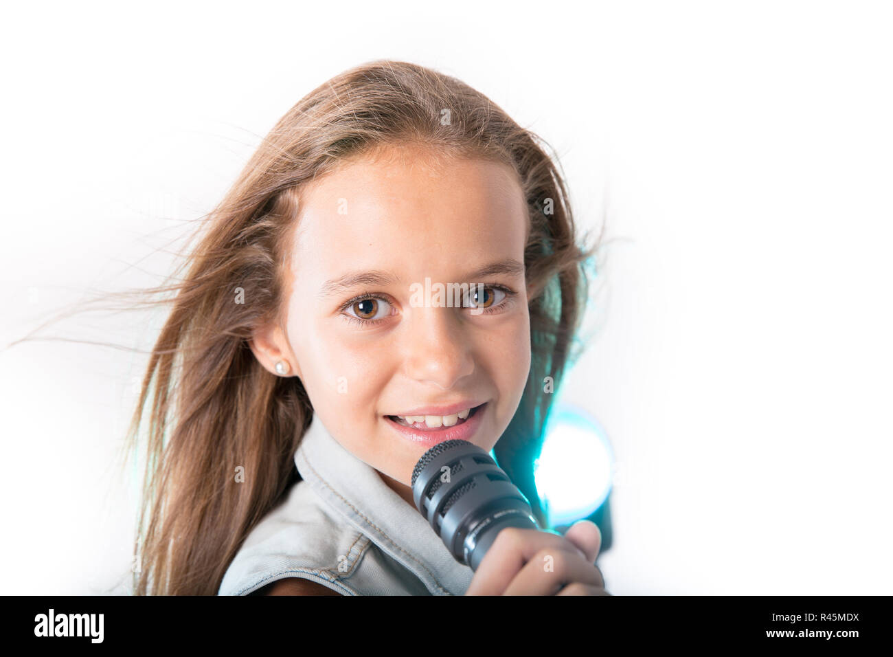 Young girl singing with microphone Stock Photo Alamy