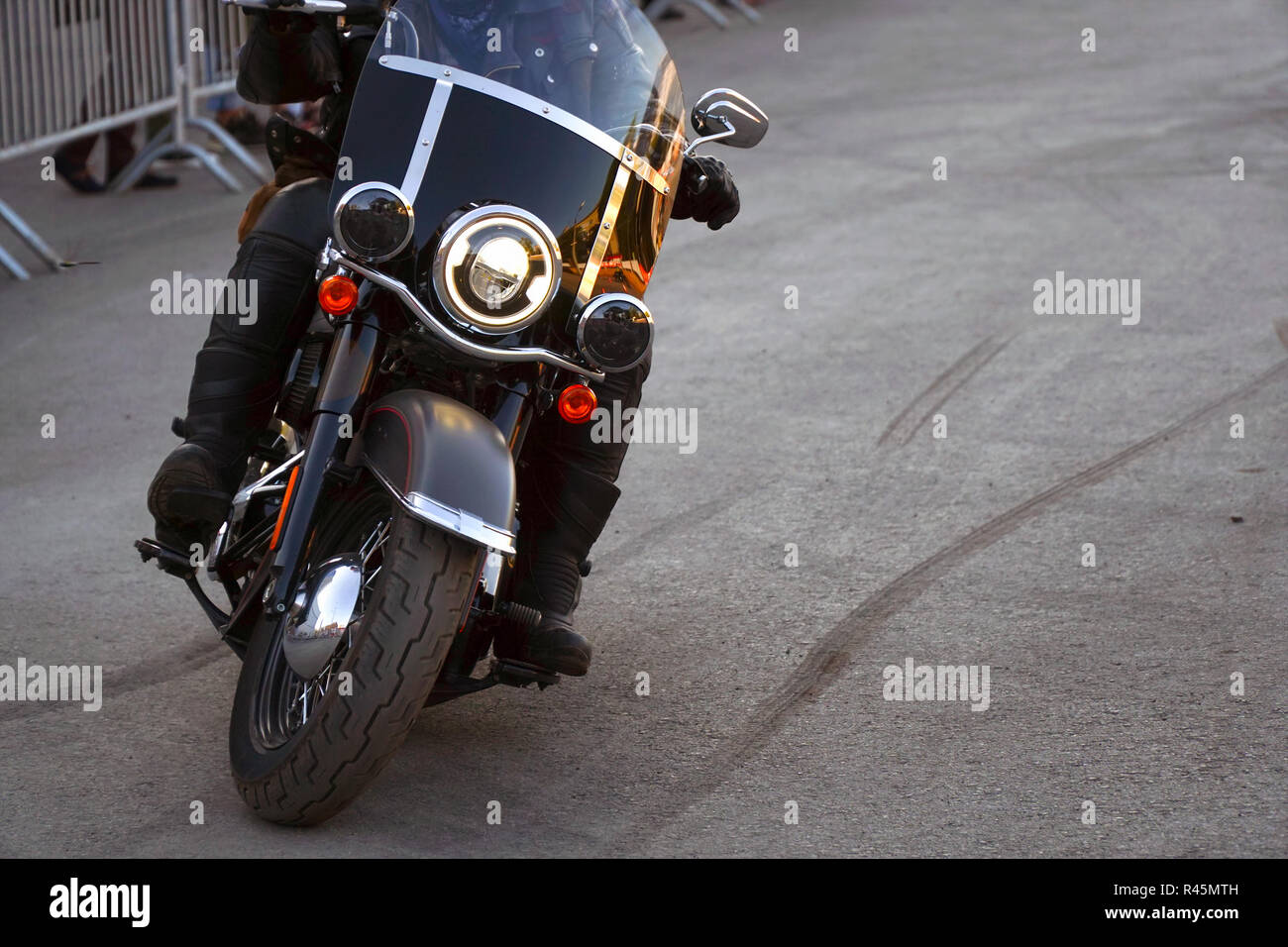 Biker iriding a motorcycle. Front view Stock Photo - Alamy