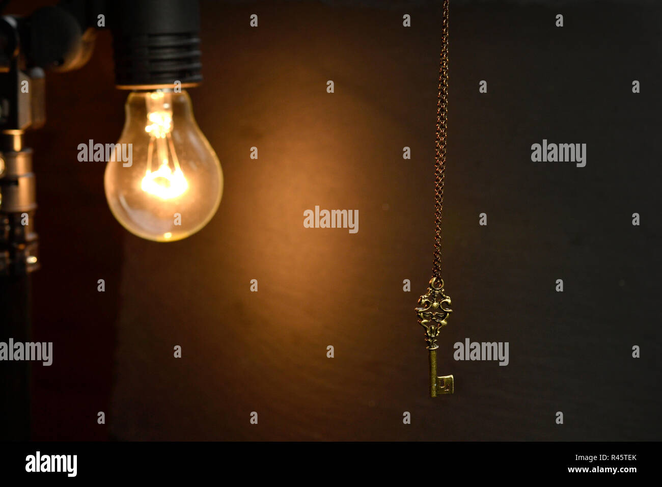 many golden lightbulb with keys on a chain Stock Photo Alamy