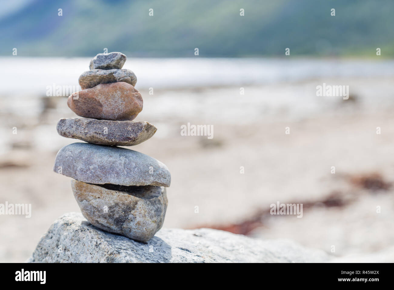Zen balance stones, smooth rock tower stacked on pebble beach background,  sunny day. Harmony and peace concept, yoga, natural therapy Stock Photo -  Alamy