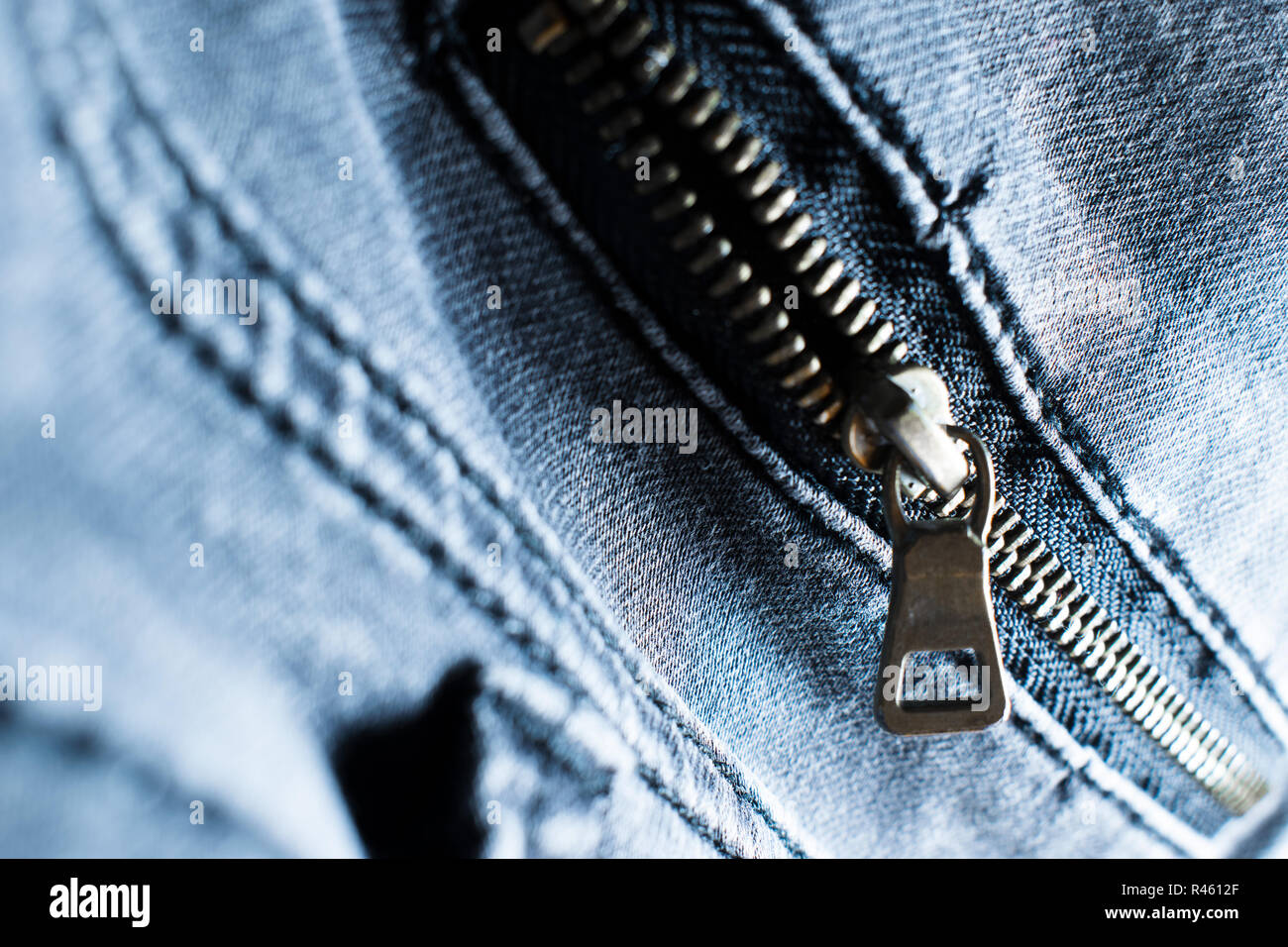 Undtagelse permeabilitet kom over Blue jeans material fabric texture fashion seam fittings zipper macro Stock  Photo - Alamy