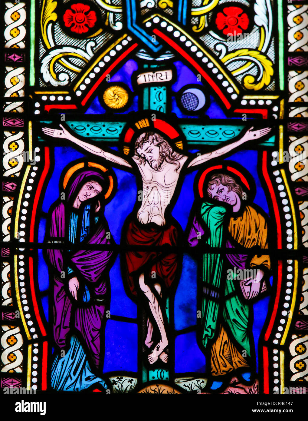 Stained Glass in the Cathedral of Monaco, depicting Jesus on the Cross Stock Photo