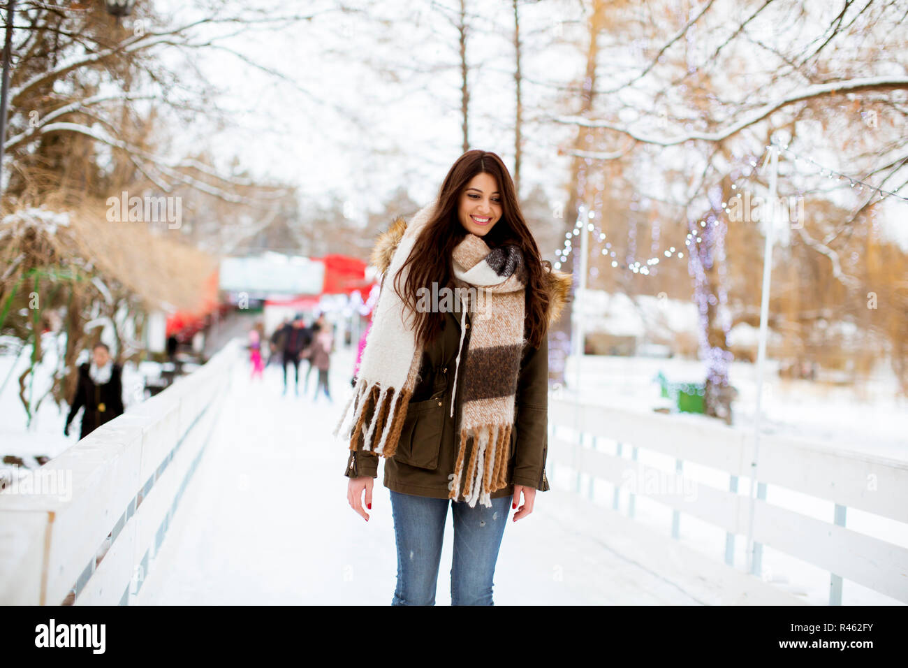 Portrait of young woman rides ice skates in the park Stock Photo