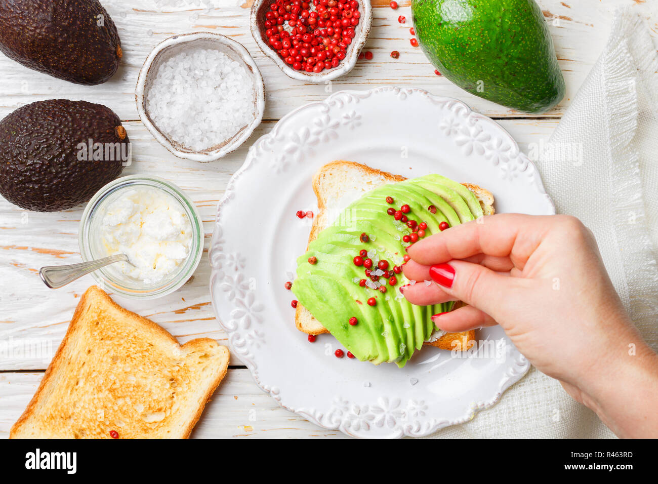 Preparation Of Bread Toast With Avocado Cottage Cheese Ricotta