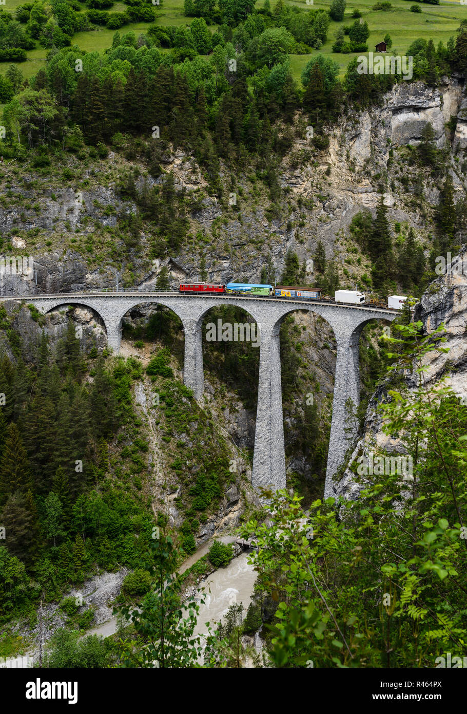 Cargo train goes over the famous railway bridge Landwasser Viaduct