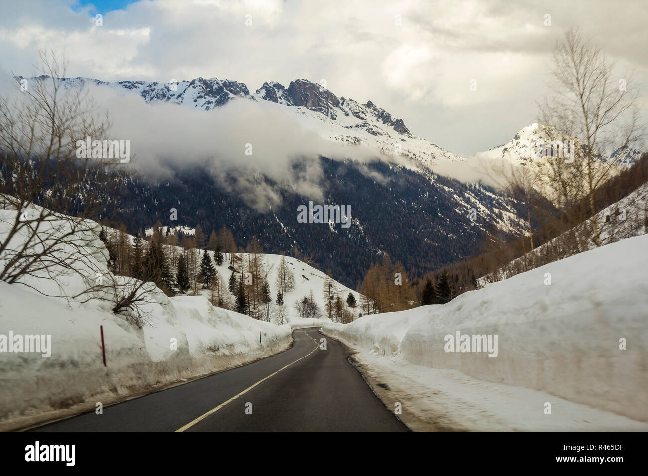 Empty Twisty Asphalt Road Stretching Through Deep Snow Towards Beautiful Bright White Alps Steep Rocky Woody Snowy Mountain Peaks Under Cloudy Winter Stock Photo Alamy Empty Twisty Asphalt Road Stretching Through Deep Snow Towards Beautiful Bright White Alps Steep Rocky Woody Snowy Mountain Peaks Under Cloudy Winter Stock Photo Alamy