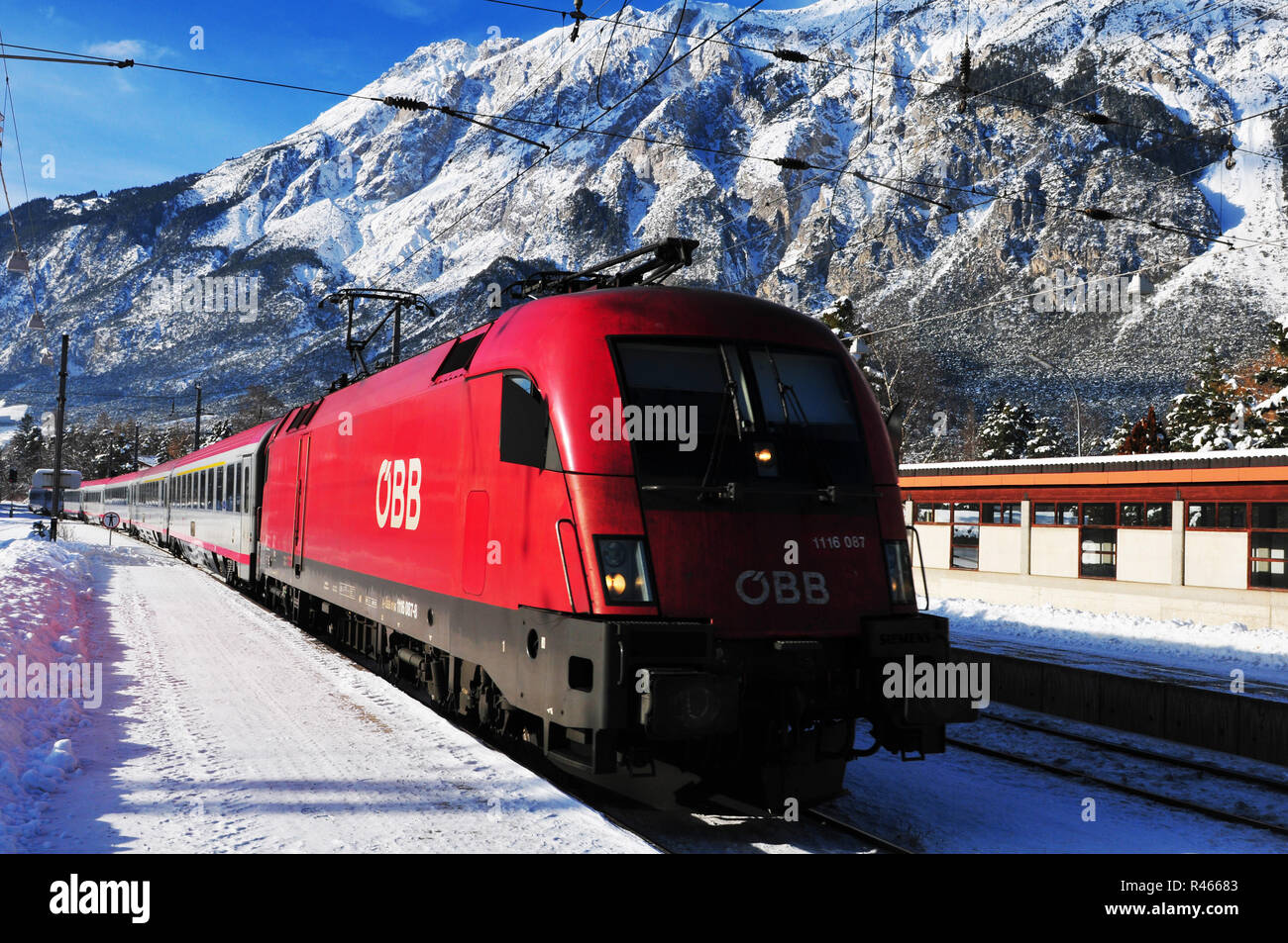 The Austrian ÖBB-Railjet is connecting Zürich via Wien with Budapest and is driving through the VOrarlberger snowmountains. Stock Photo