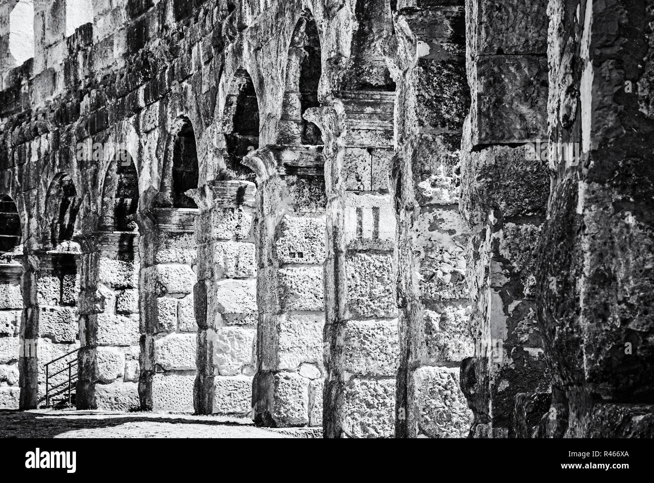 Detail photo of Pula Arena, Istria, Croatia. Travel destination. Ancient architecture. Black and white photo. Stock Photo