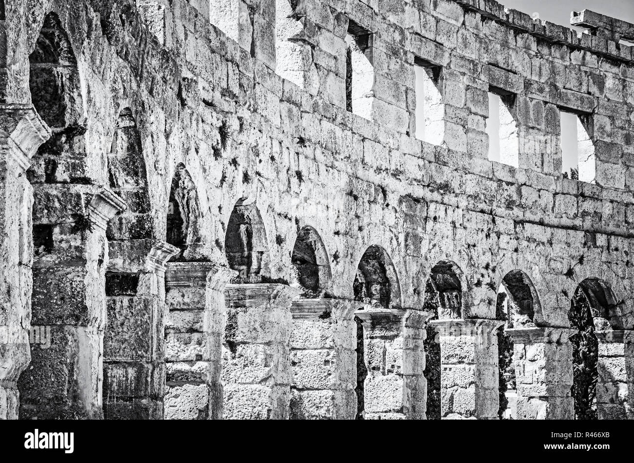 Detail photo of Pula Arena, Istria, Croatia. Travel destination. Ancient architecture. Black and white photo. Stock Photo