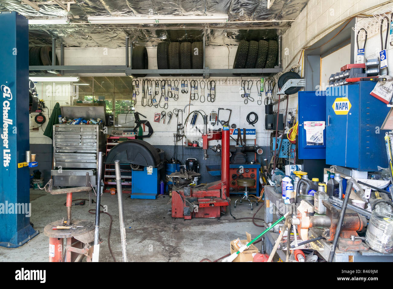 Messy interior of a garage with machines and tools, USA. Stock Photo