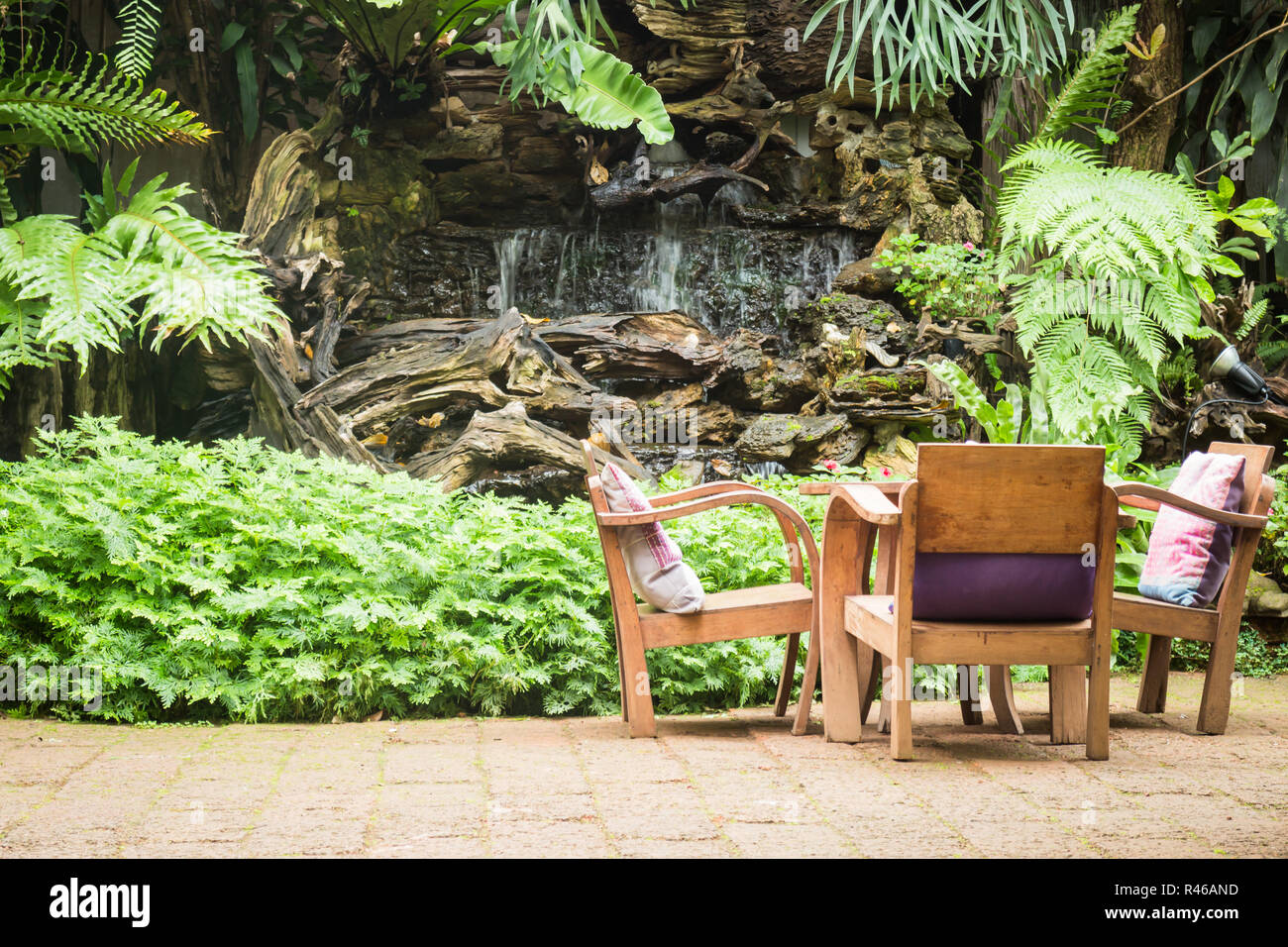 Outdoor wooden chair in the garden Stock Photo - Alamy