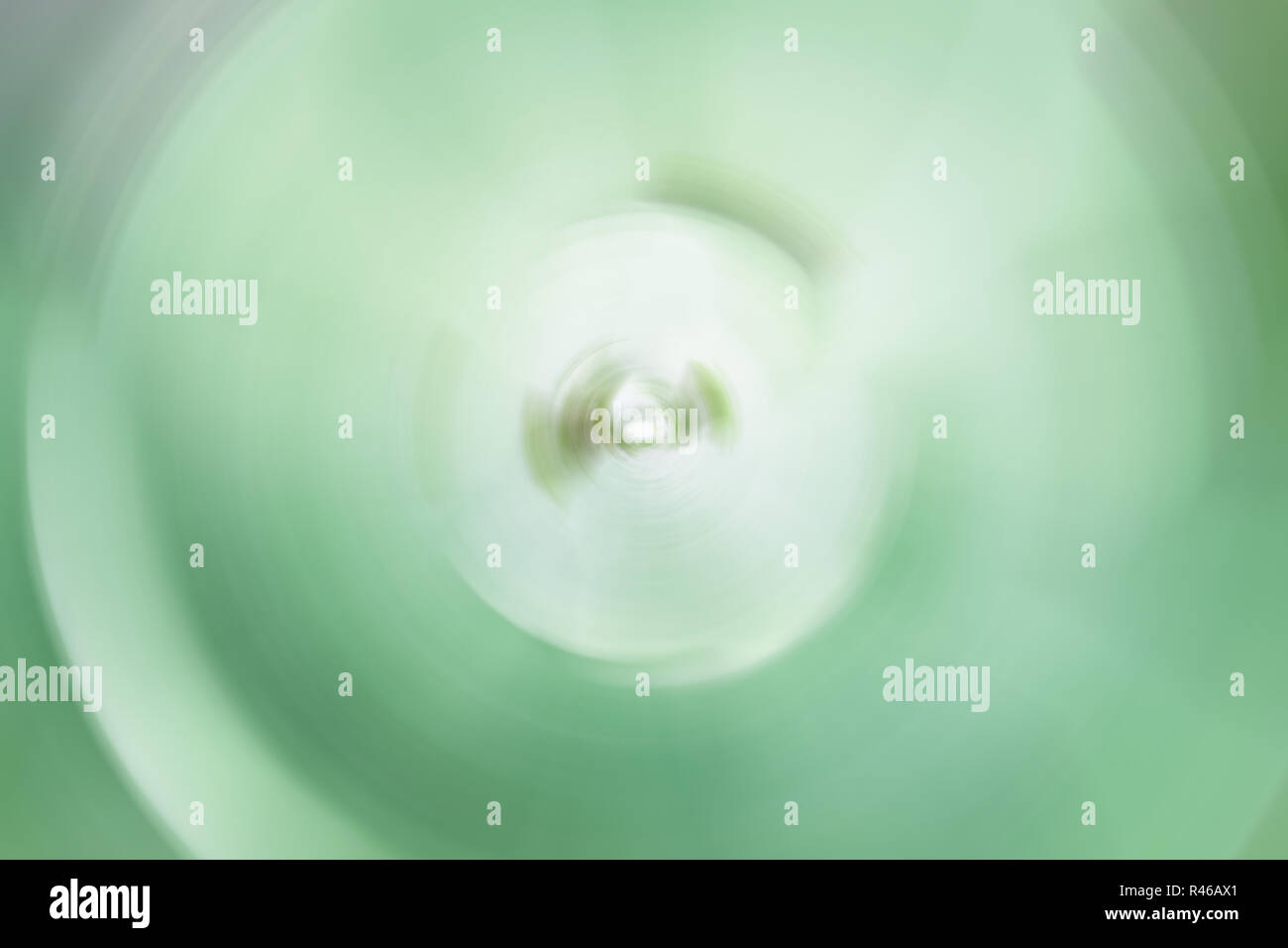 Abstract green leaves background of spin blur Stock Photo - Alamy