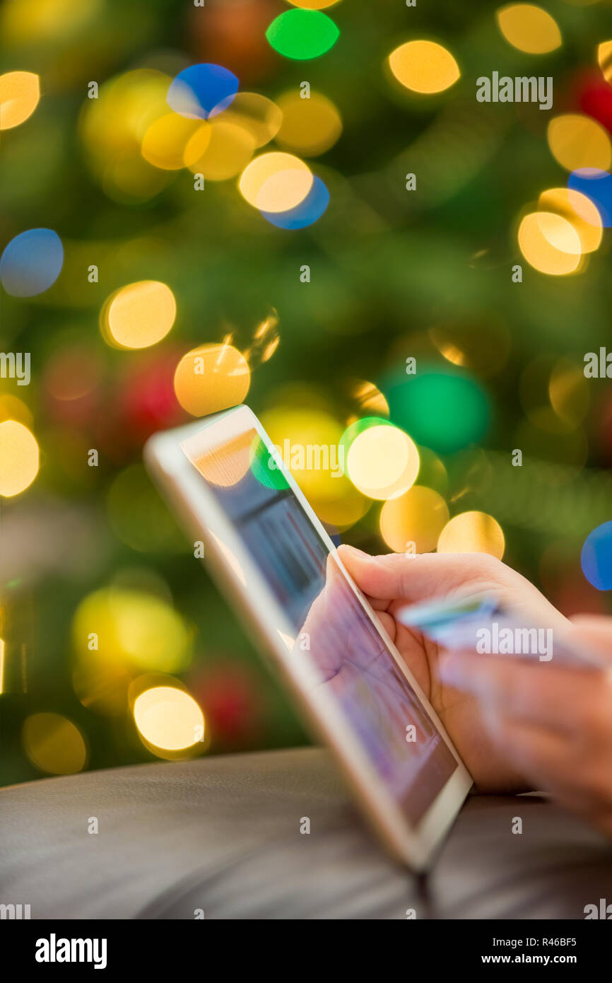 Holiday shopping using tablet Stock Photo