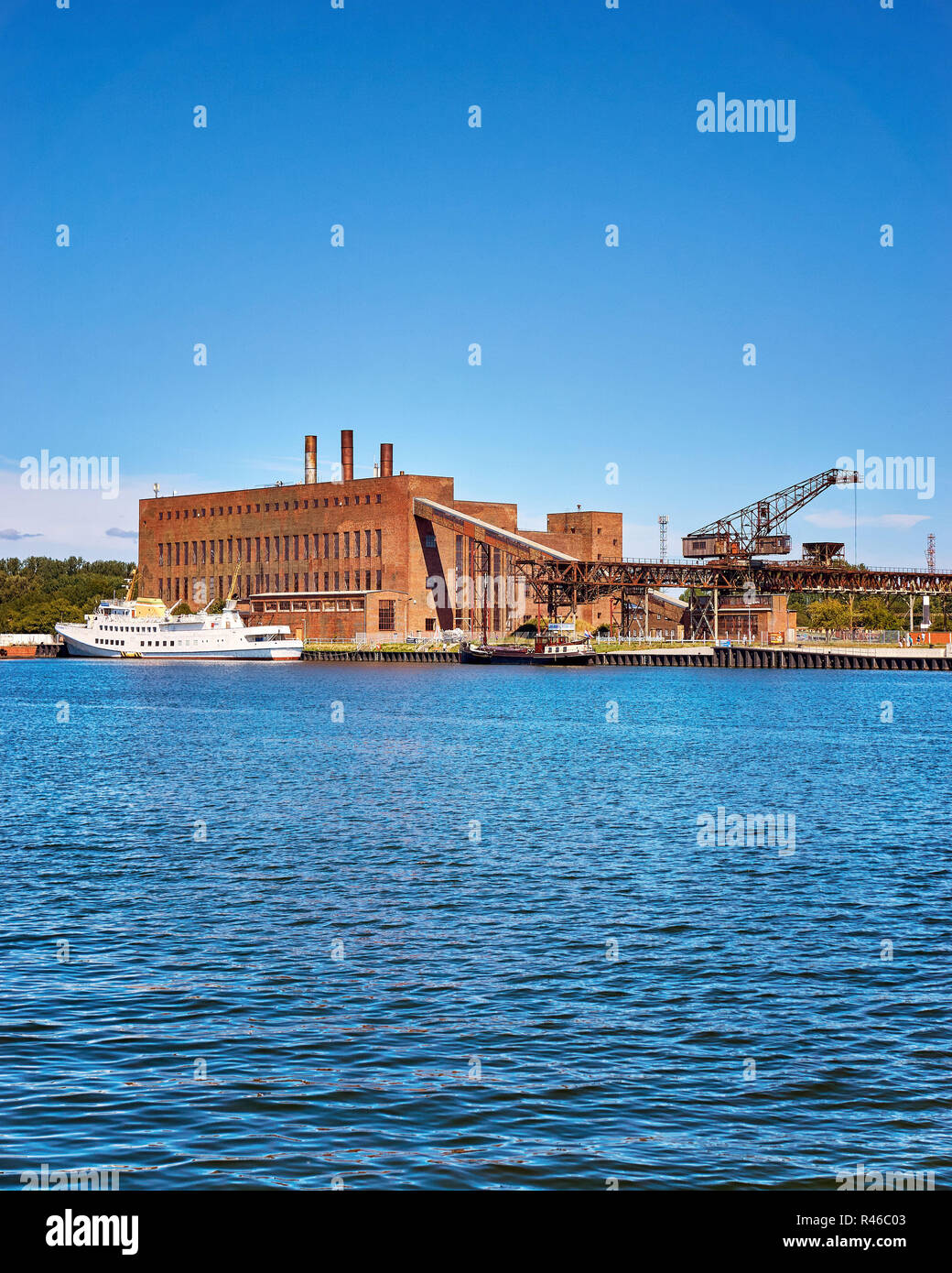 Military factory and boats in the port of Peenemünde. Stock Photo