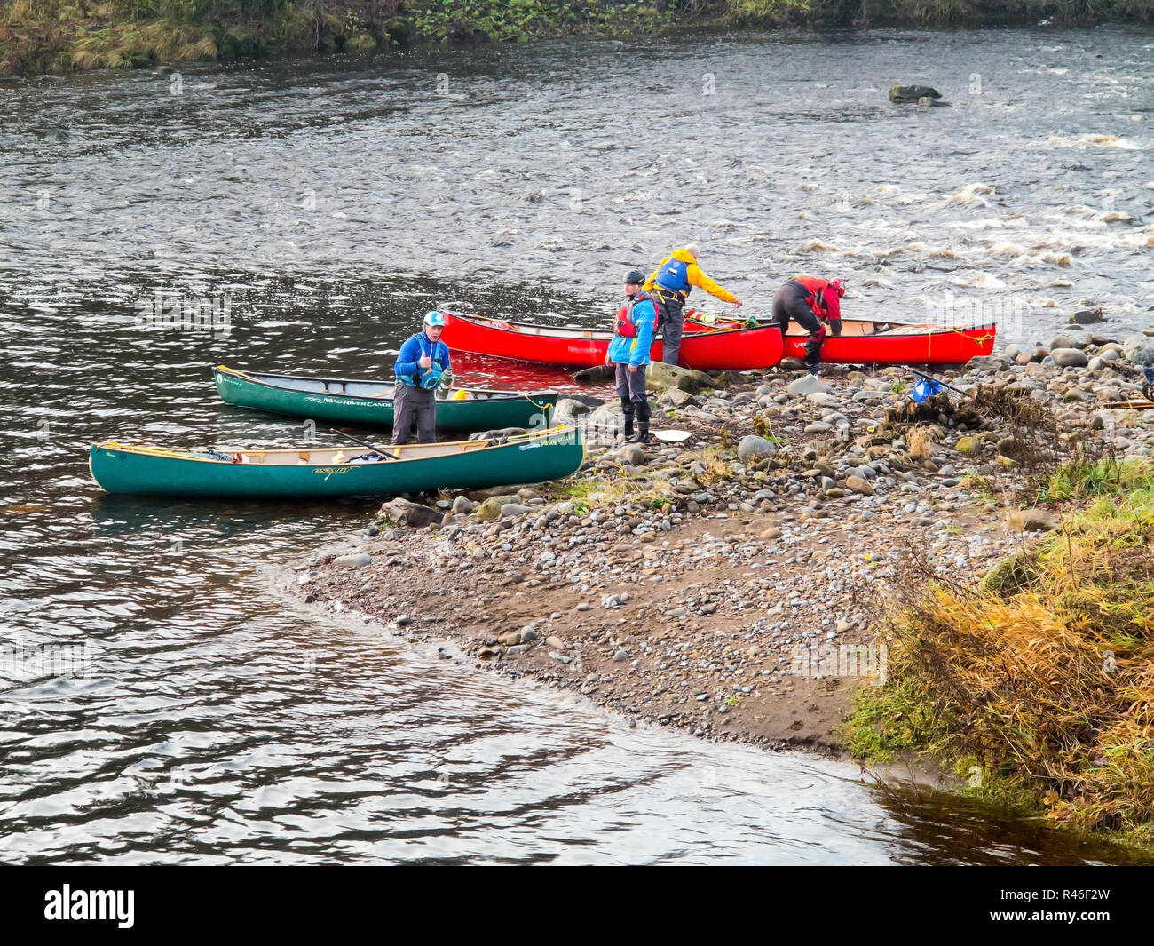 Canoeists and kayakers preparing to set out canoeing and kayaking along the river Tees in Barnard Castle County Durham England UK Stock Photo