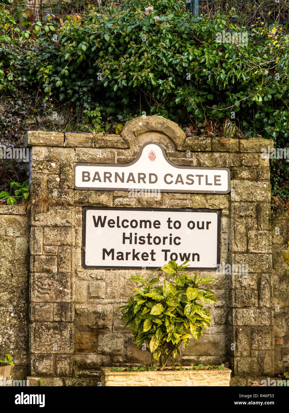 Sign on a wall welcoming people to the historic market town of Barnard Castle in County Durham England Stock Photo