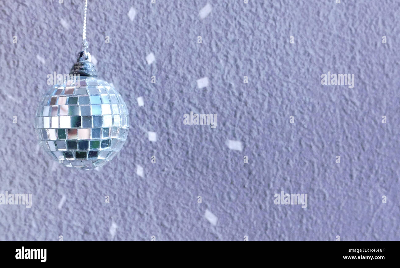 small decoration disco ball with reflection on the wall Stock Photo
