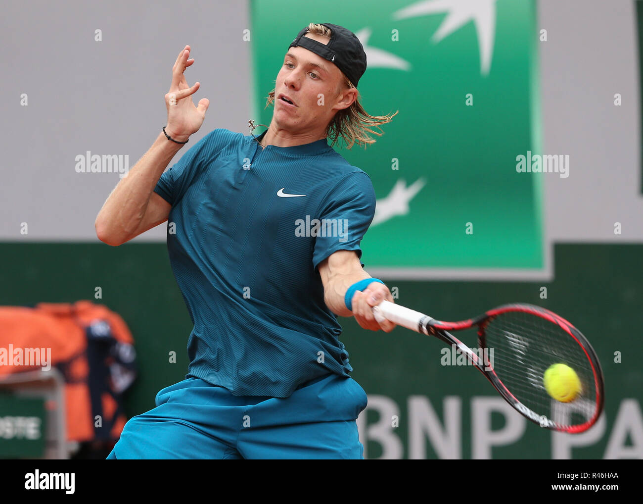 Canadian tennis player Denis Shapovalov playing forehand shot in French Open  2018 tennis tournament, Paris, France Stock Photo - Alamy
