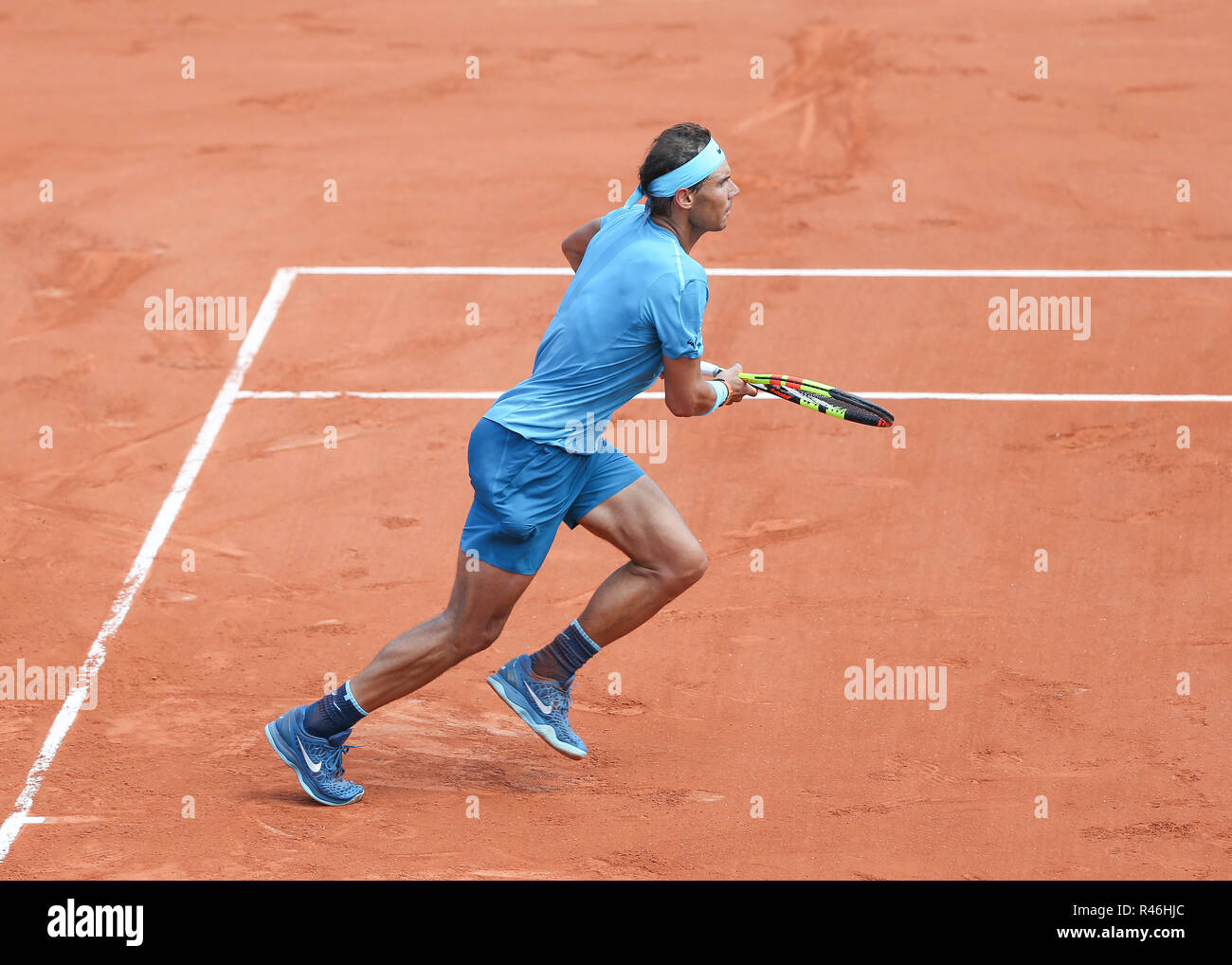 Spanish tennis player Rafael Nadal running forward during French Open 2018 tennis tournament, Paris, France Stock Photo