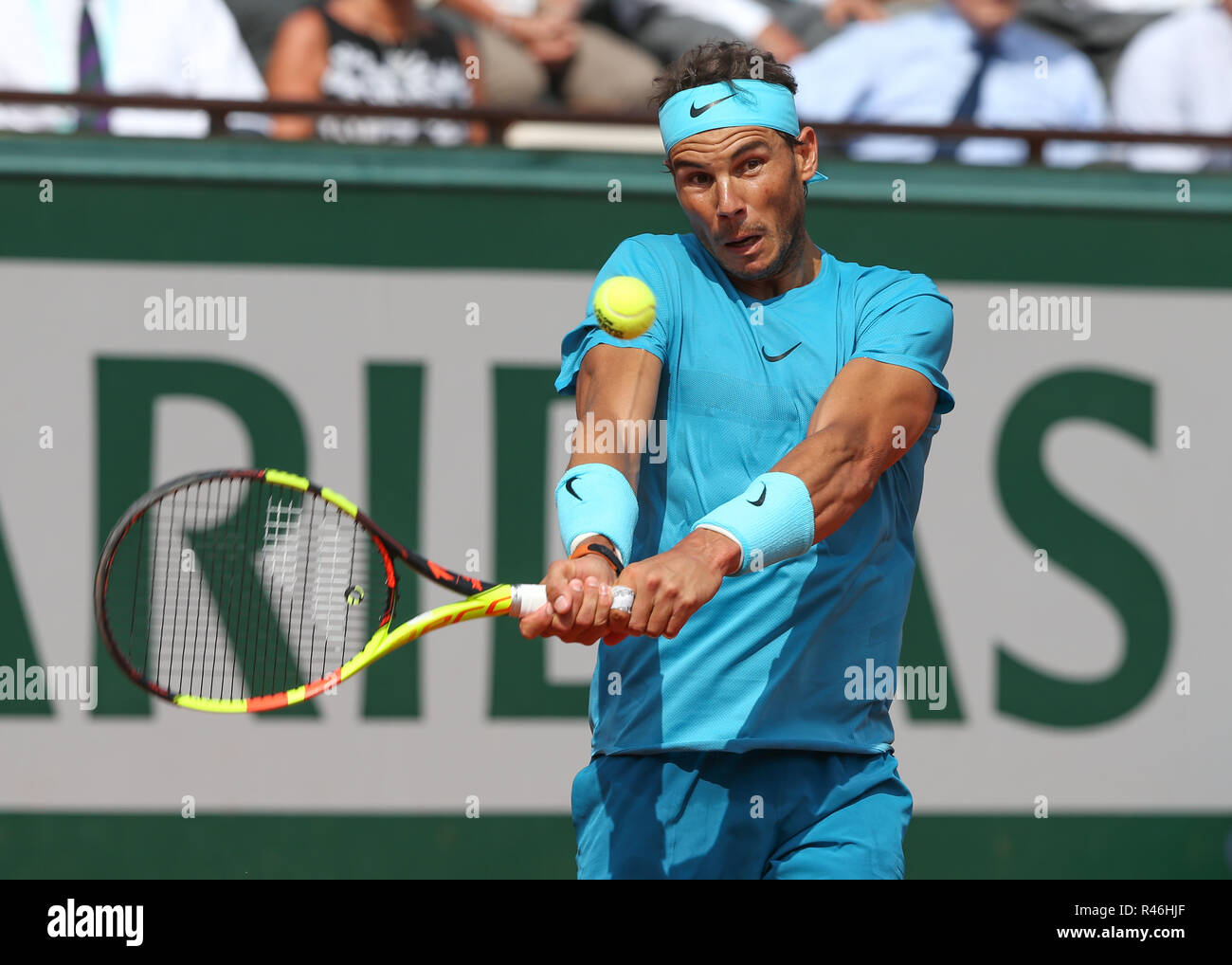 Spanish  tennis player Rafael Nadal  playing backhand shot at the French Open 2018, Paris, France Stock Photo
