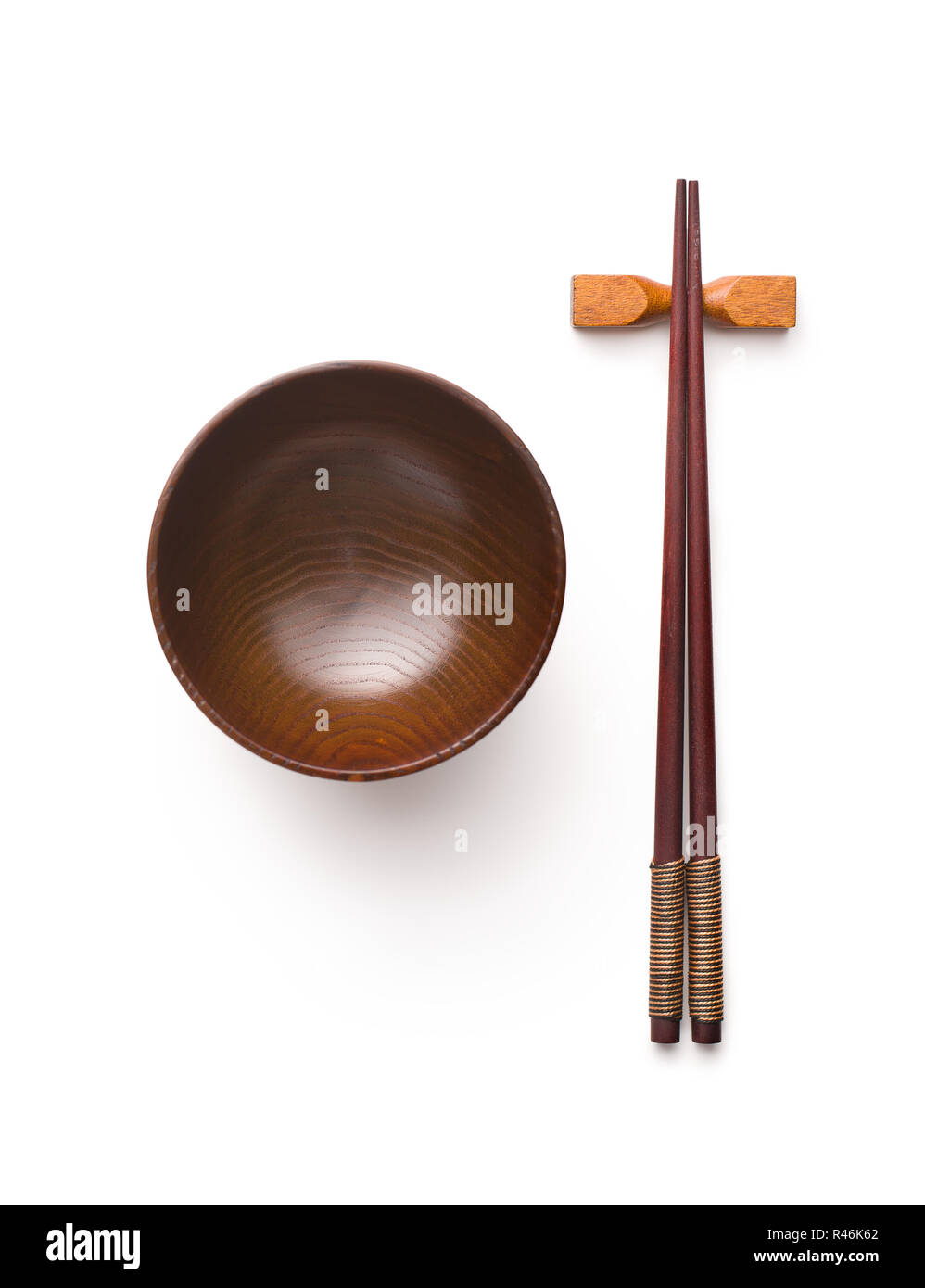 Wooden bowl and chopsticks isolated on white background. Stock Photo
