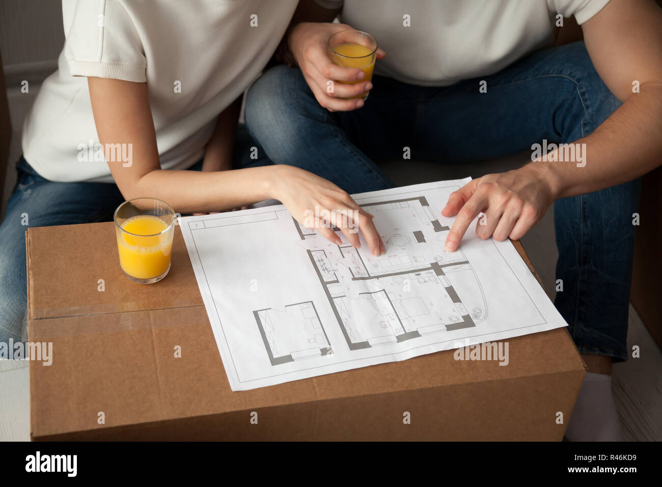 Young couple discussing house architectural plan close up Stock Photo