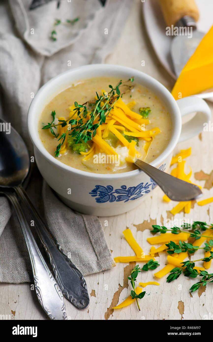 broccoli cheddar chicken and dumpling soup.style rustic.selective focus
