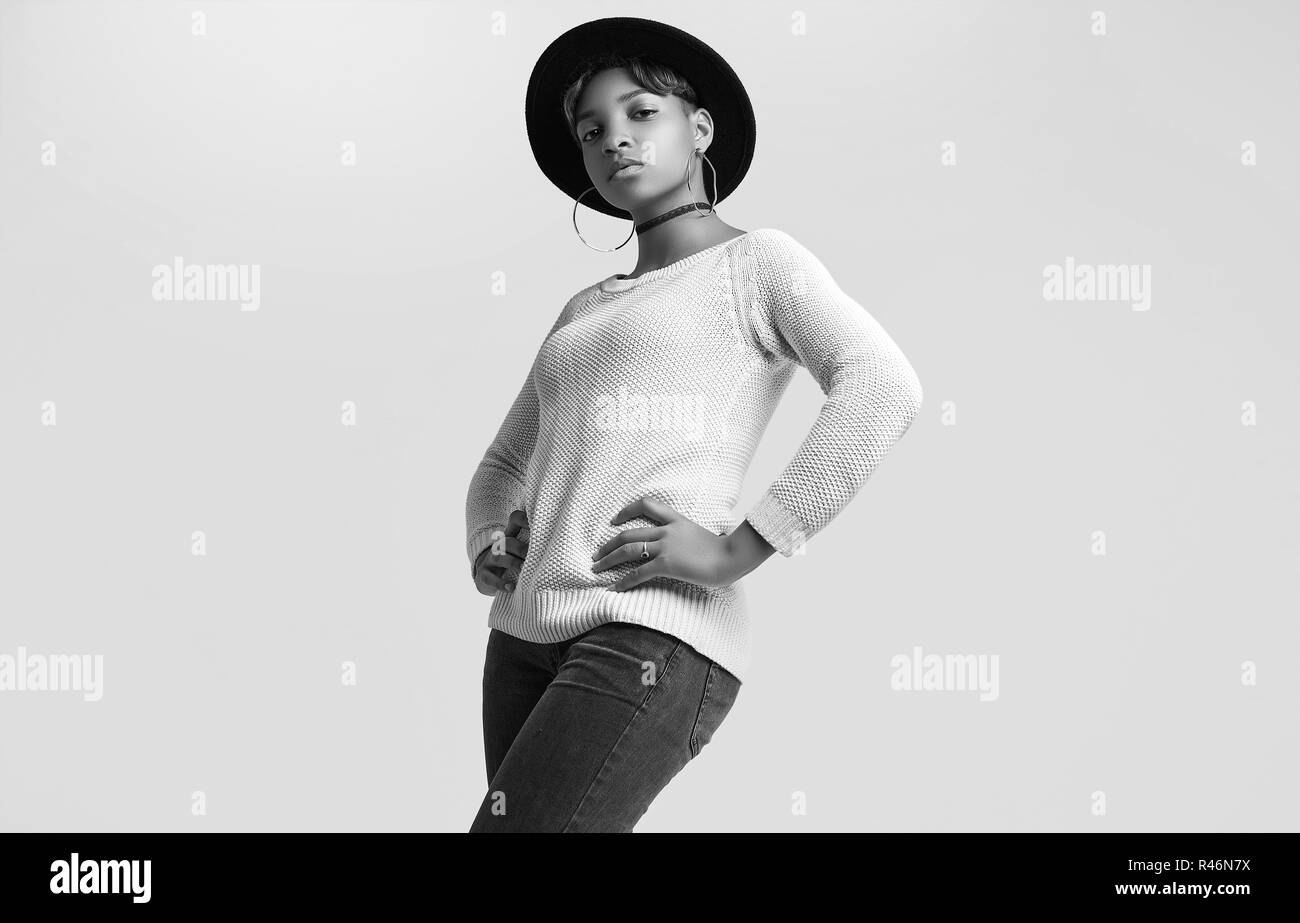 Portrait of young beautiful hipster black girl with short hair in white
