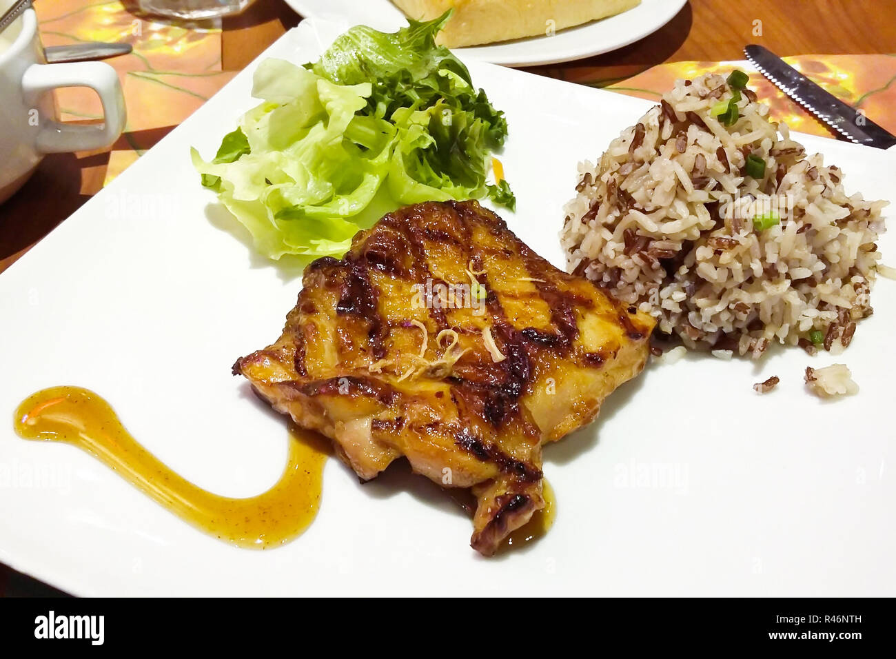 Chicken steak in a dish Serve with rice Stock Photo Alamy