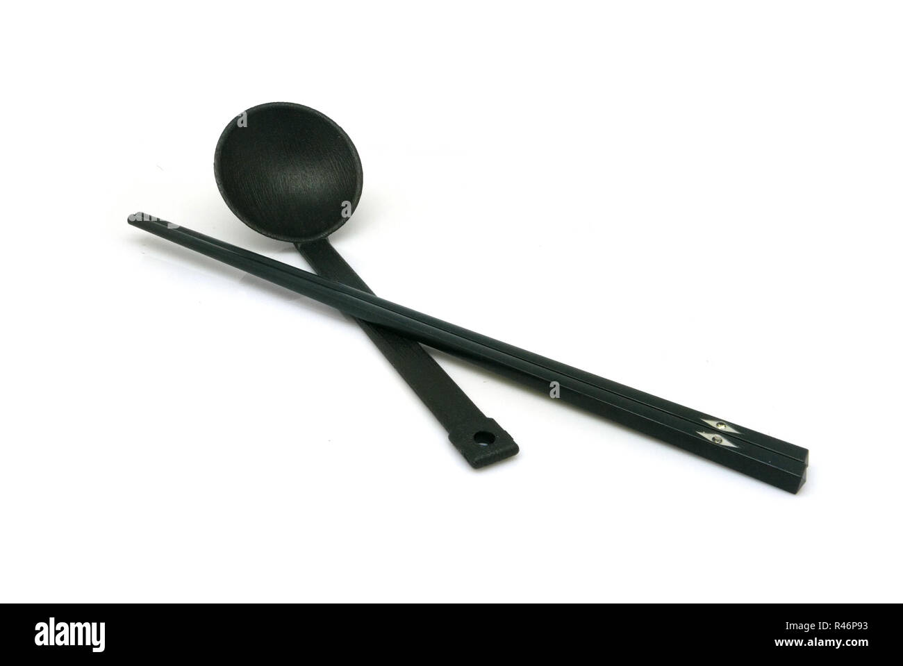 Black spoon and chopsticks isolated Stock Photo Alamy