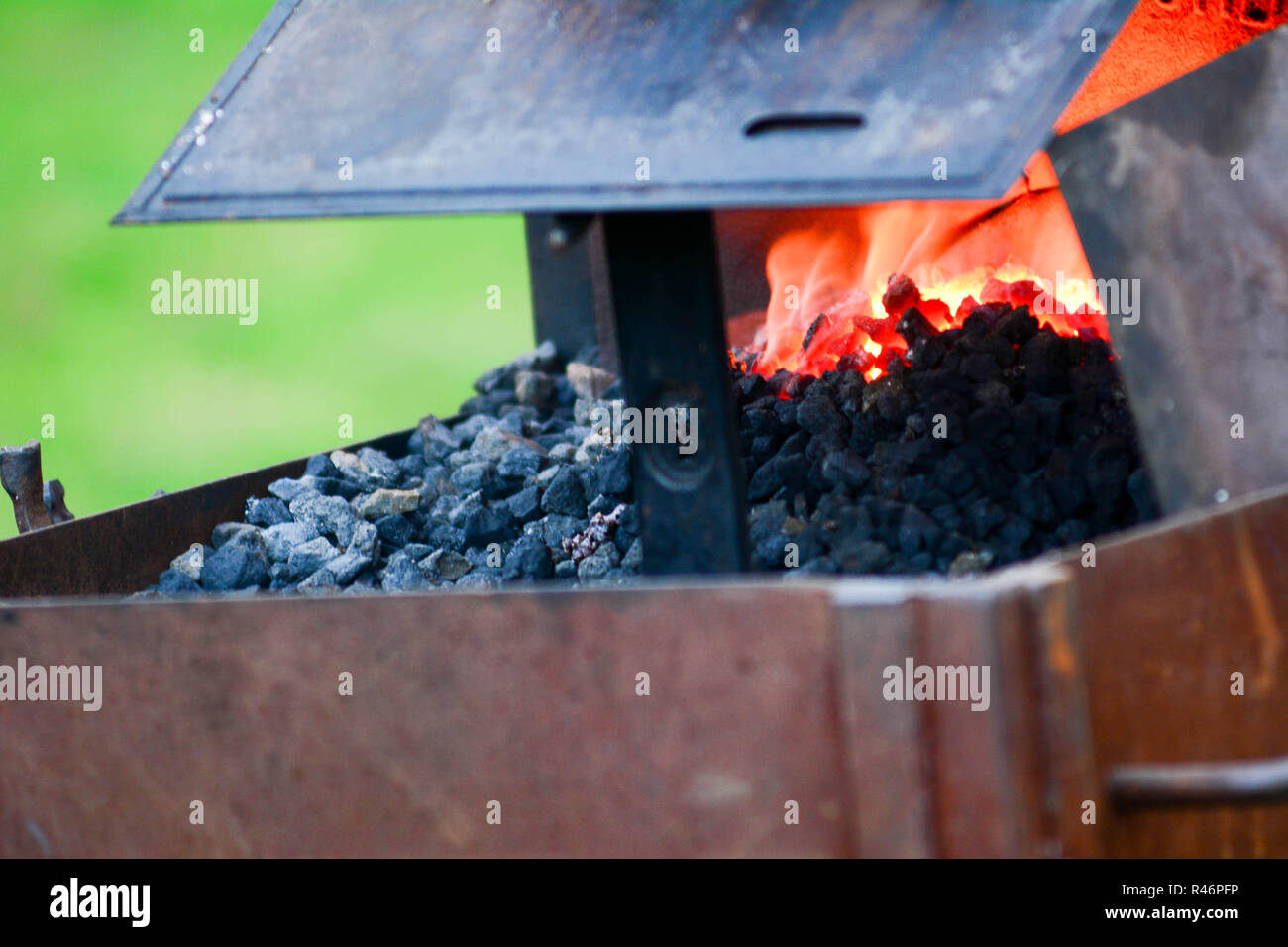 Close Up Of Coals Burning In Blacksmiths Portable Fire Pit Stock