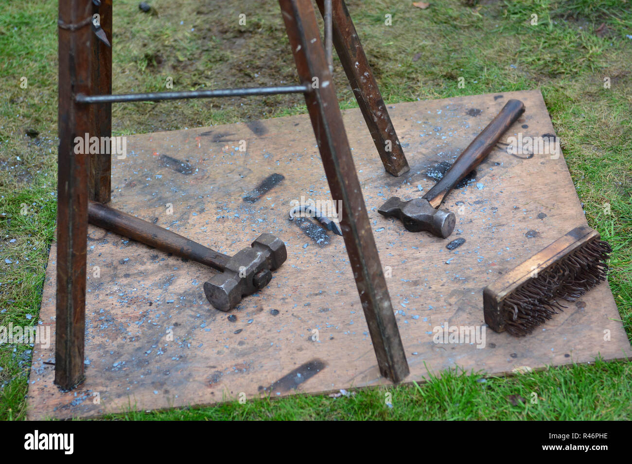Antique blacksmith hammers and brush on floor Stock Photo Alamy