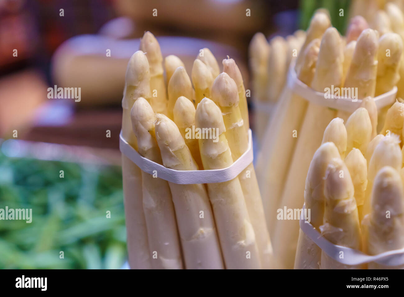 Close up of bunch of white asparagus in grocery store produce section Stock Photo