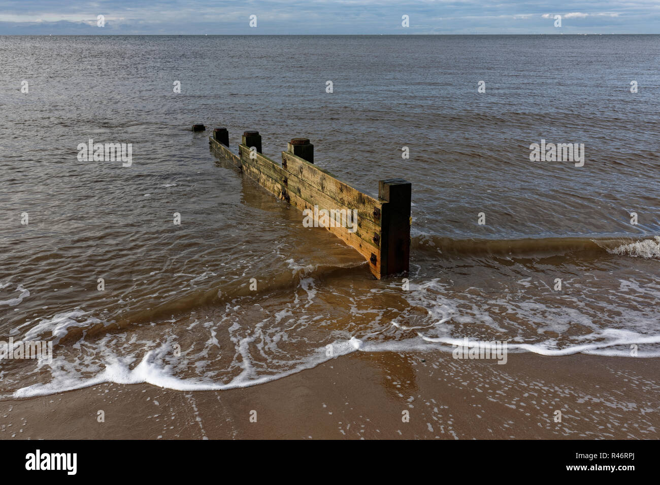 Timber groyne on cleveleys beach on the fylde coast in lancashire uk Stock Photo