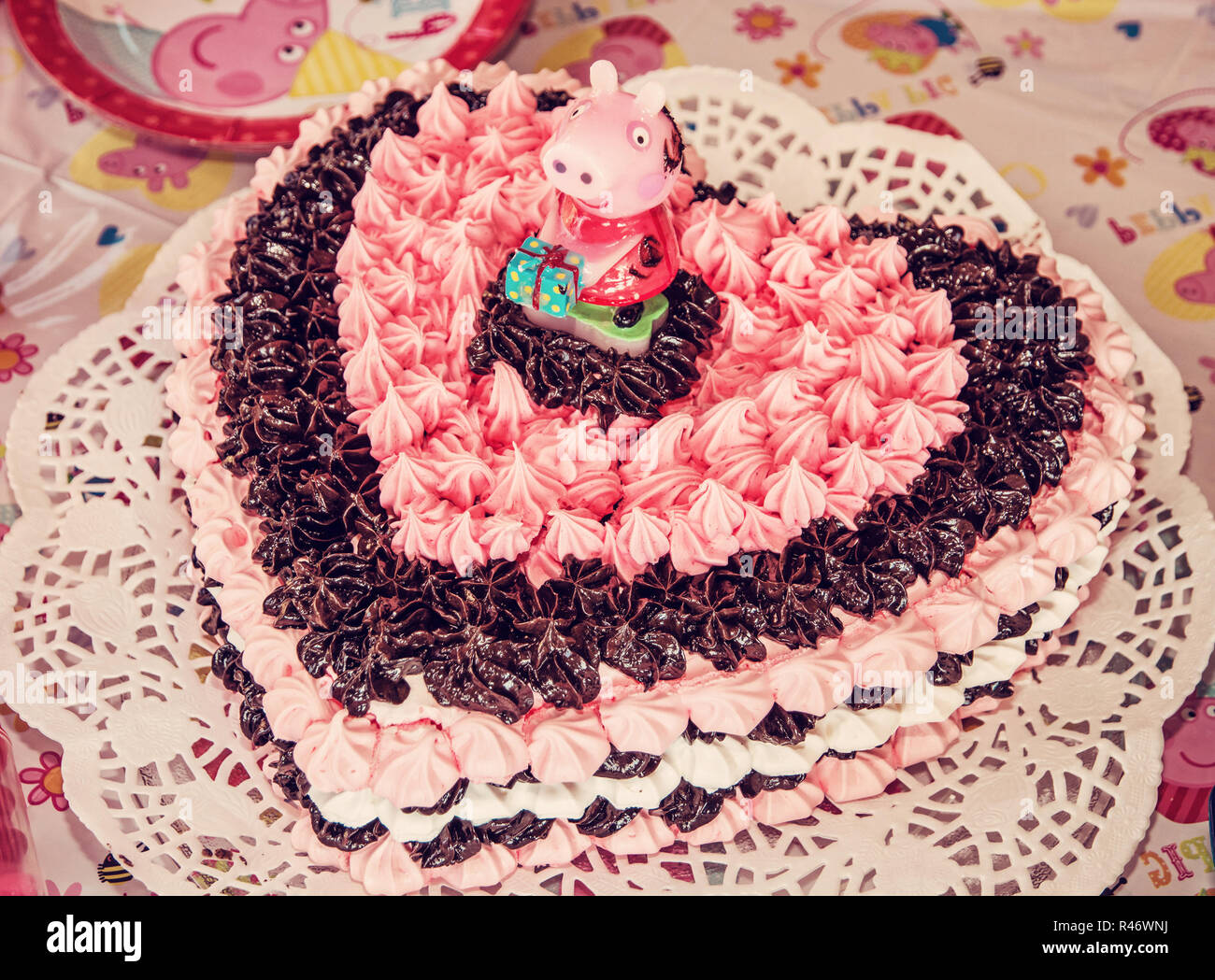 Big birthday chocolate and foam cake with sugar pig. Symbolic food ...