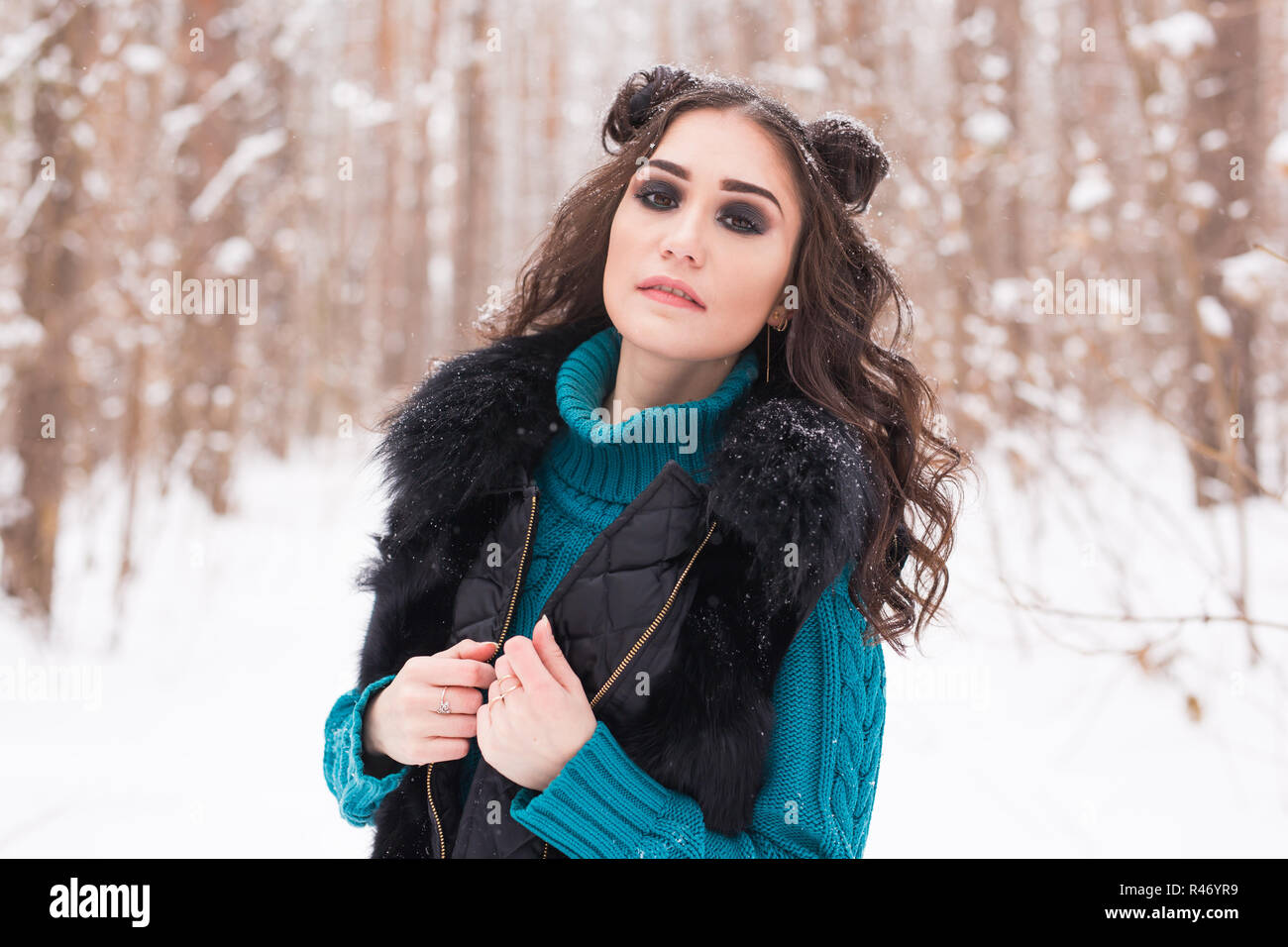 Beautiful young woman walking in the winter snowy nature Stock Photo ...