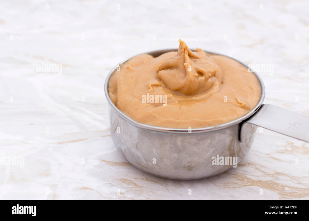 Peanut Butter Measuring Cup On Grey Stock Photo 225772072