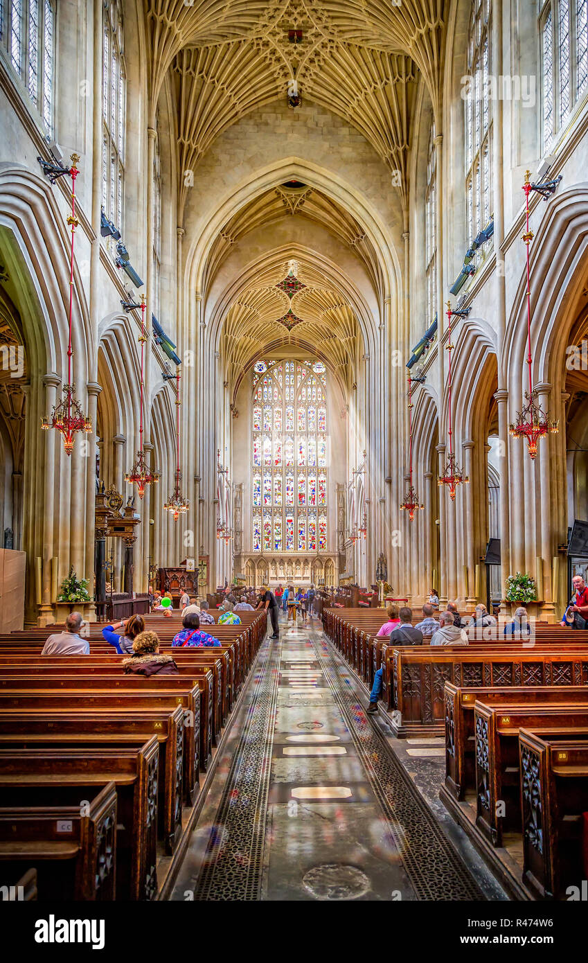 Light streaming through stained glass windows in Bath Abbey, Somerset