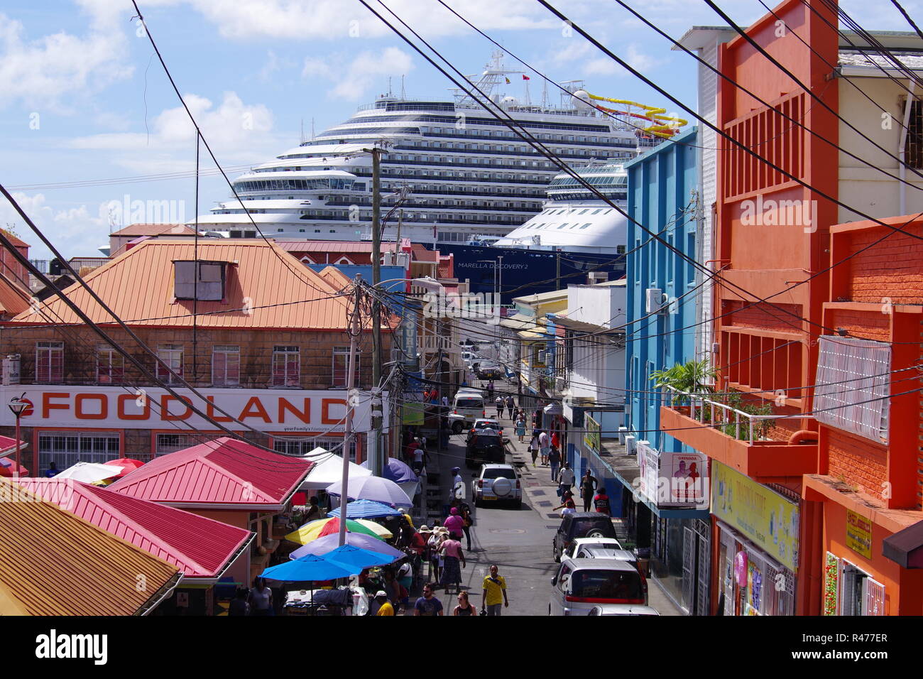 Grenada street scene with cruise ships in port Stock Photo Alamy
