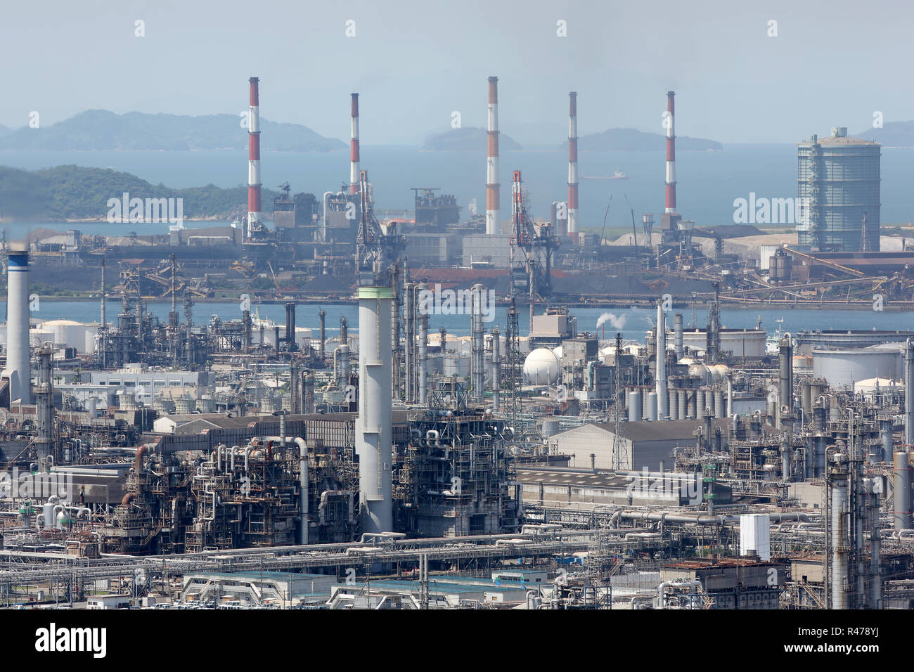 refinery plant with smoke stacks, industrial site Stock Photo