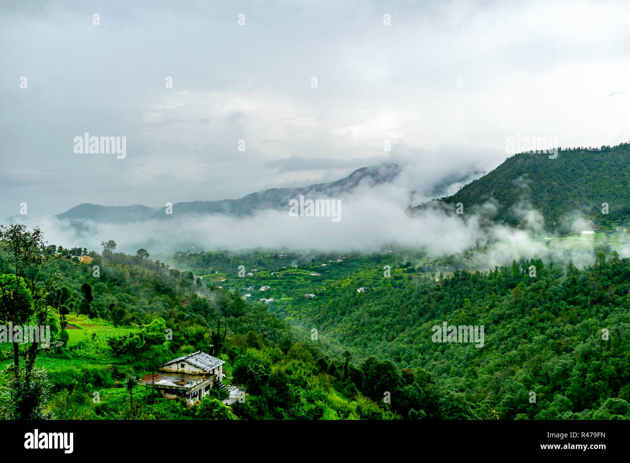 clouds floating over the mountain range as seen while driving to Binsar, near Almora, Uttarakhand,. rainy season Stock Photo