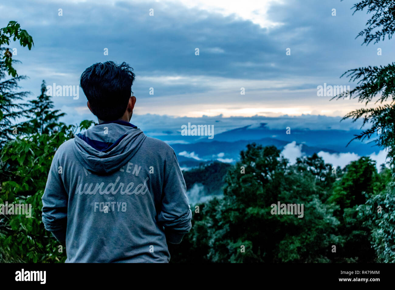 watching the sunset sky from the top of the Binsar Wildlife Sanctuary, from Dak Bunglow, rainy season Stock Photo