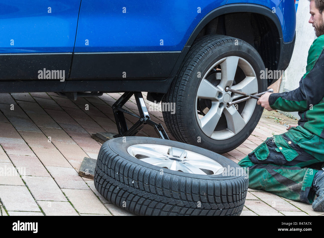 replace summer tires to winter tires Stock Photo Alamy