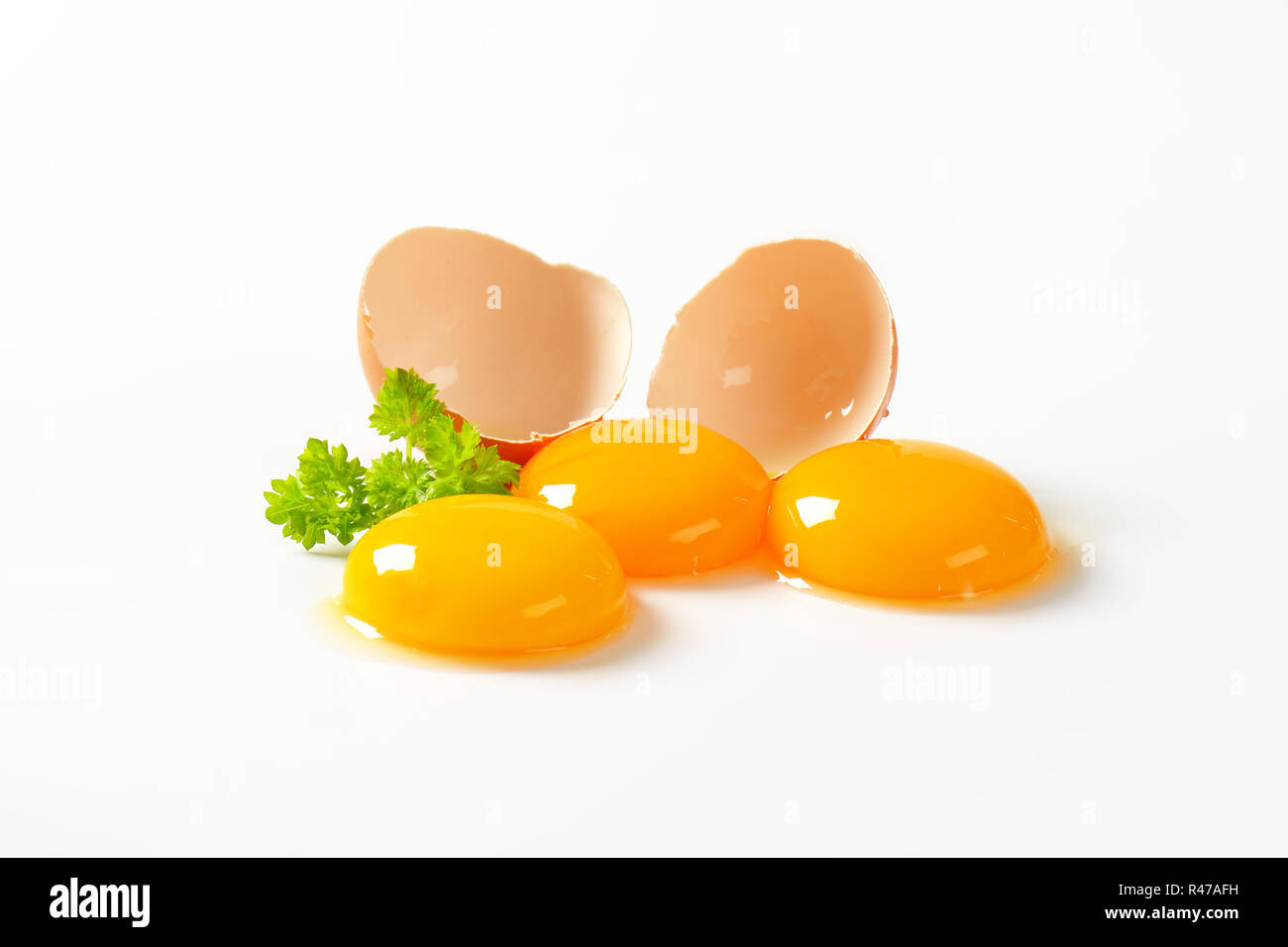 Raw egg yolks Stock Photo