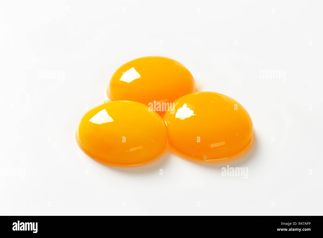 Raw egg yolks Stock Photo Alamy