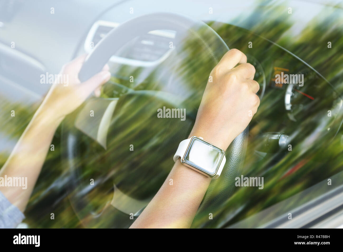 closeup hand wear smart hand watch driving car Stock Photo