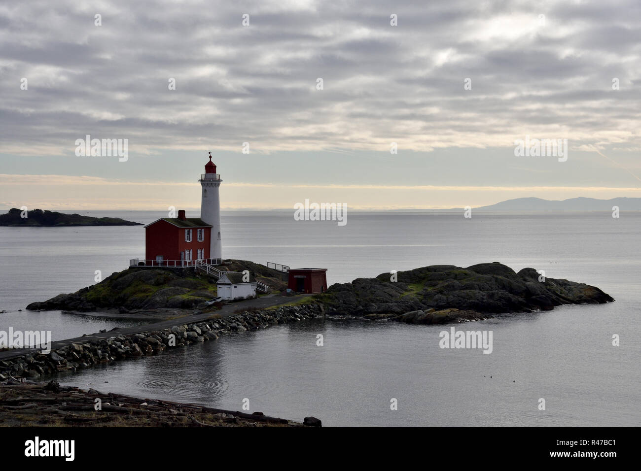 Historic Fisgard lighthouse at the entrance to Esquimalt Harbour and Royal Roads. Stock Photo