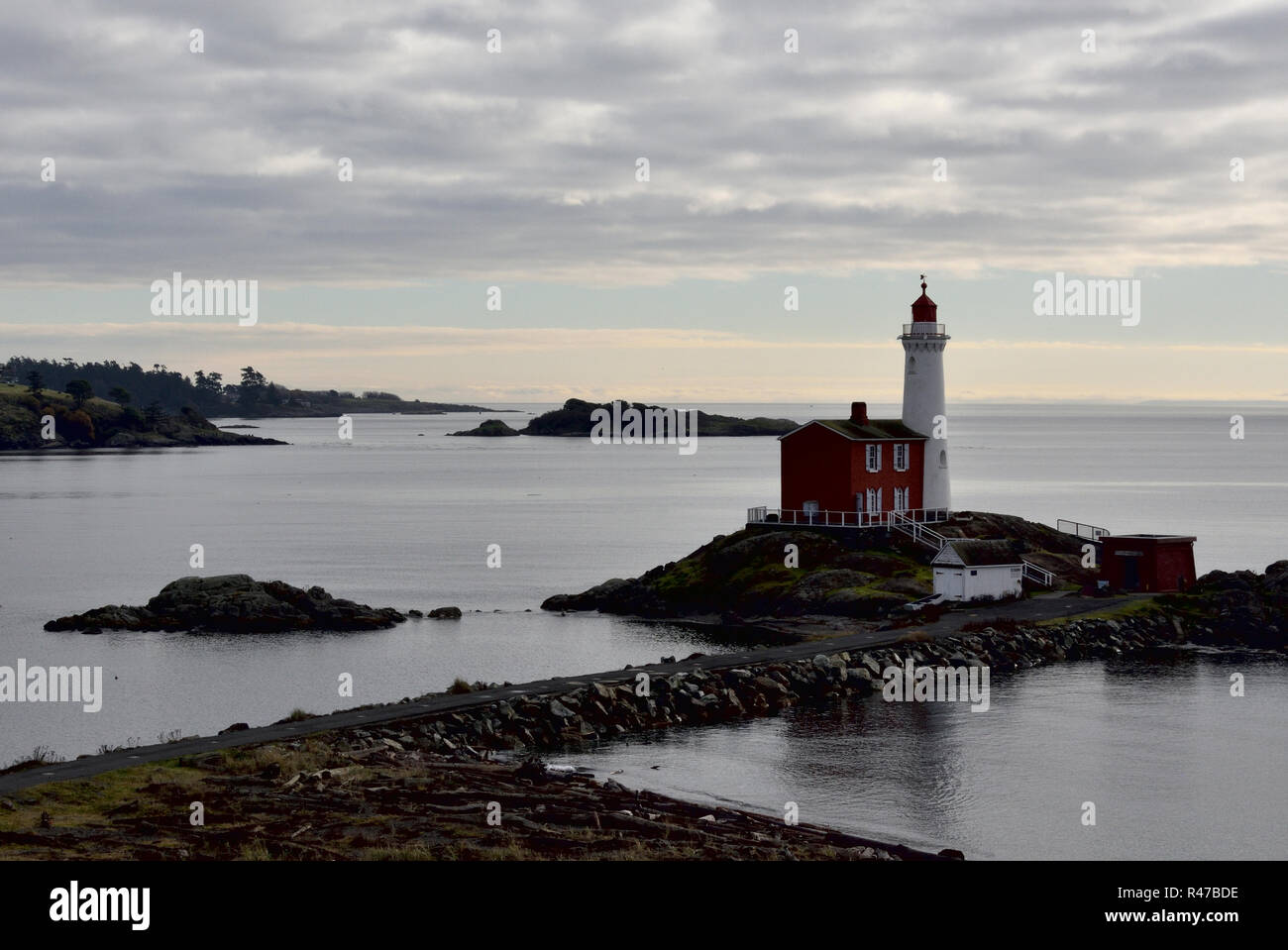 Historic Fisgard lighthouse at the entrance to Esquimalt Harbour and Royal Roads. Stock Photo